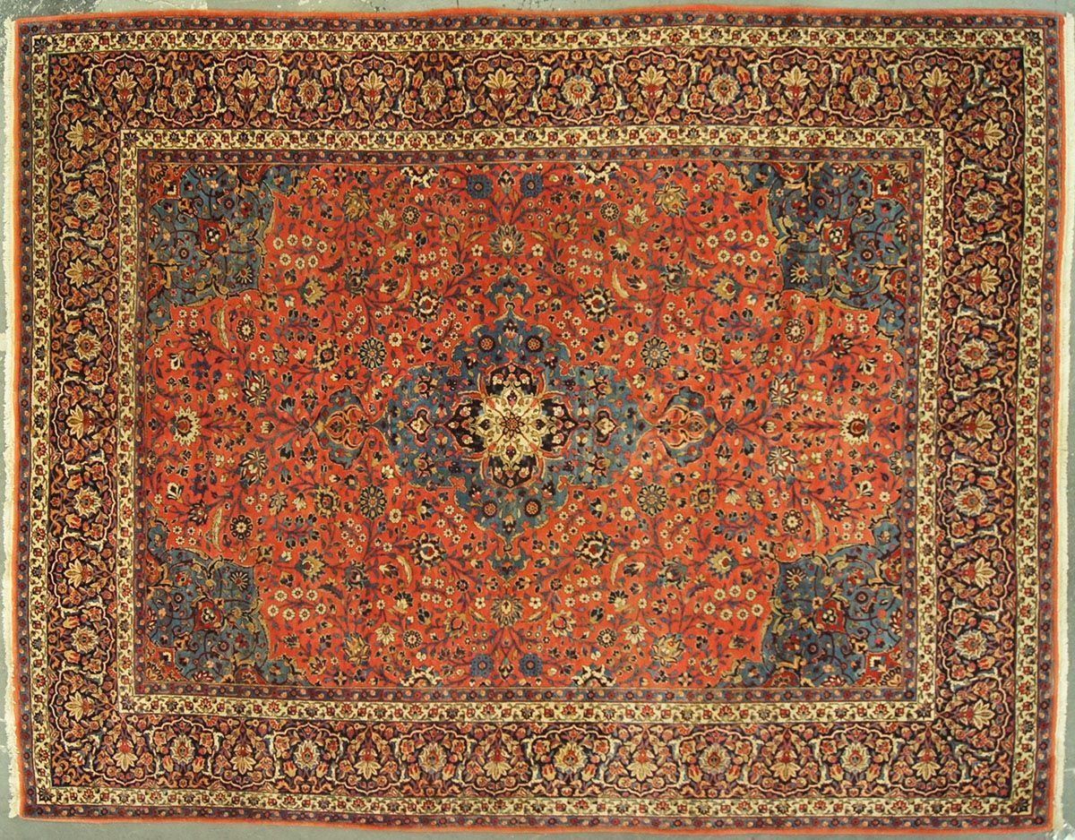 Red and blue patterned Oriental rug with ornate border.