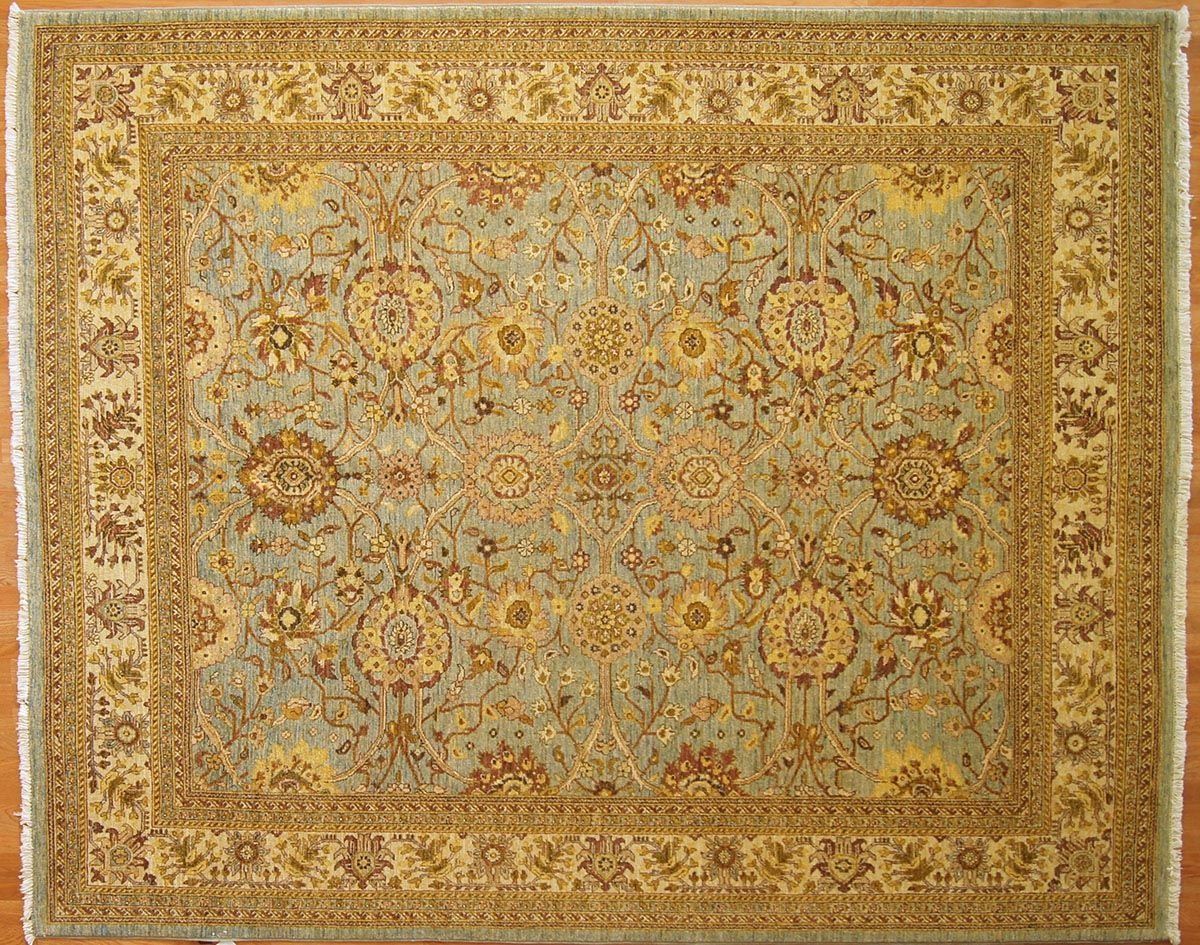 Blue and beige oriental rug with floral and geometric patterns.
