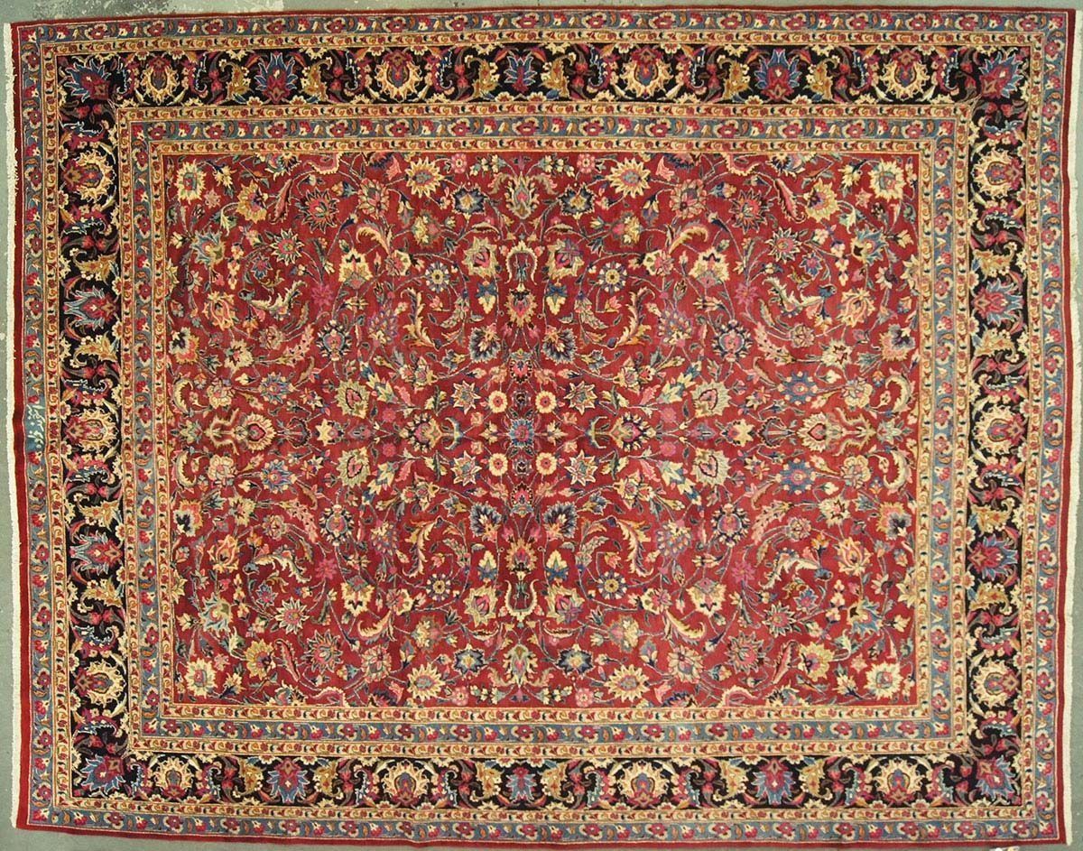 Red Persian rug with floral patterns and a dark border.
