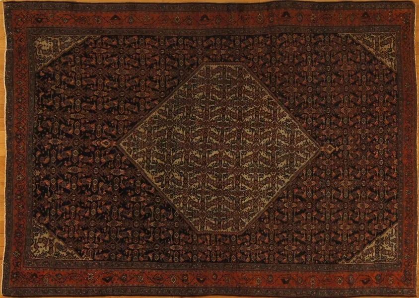 Brown Persian rug with a diamond-shaped central design and patterned borders.