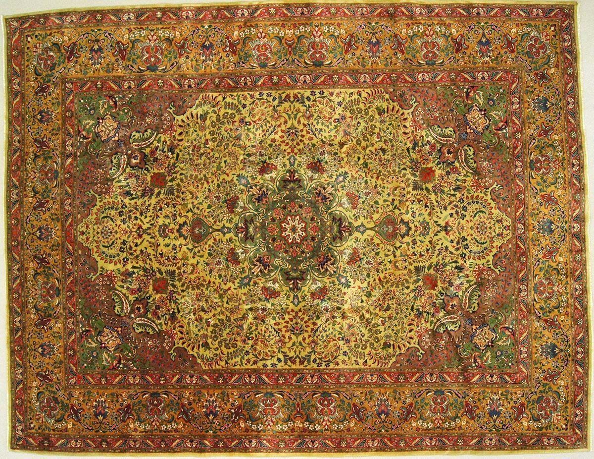 Oriental rug with intricate floral patterns in red, gold, and green.
