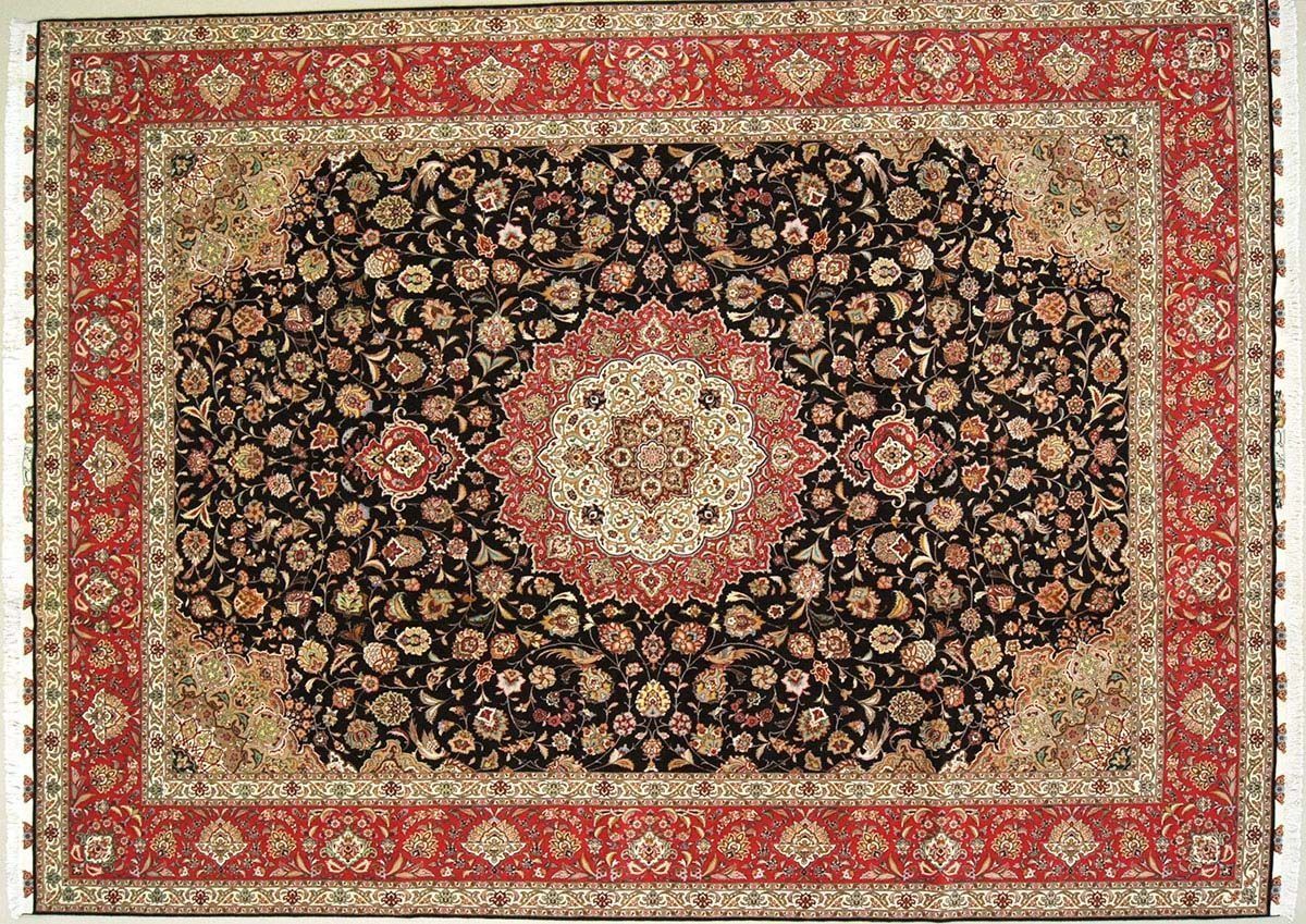 Red and black ornate oriental rug with floral design and detailed border.