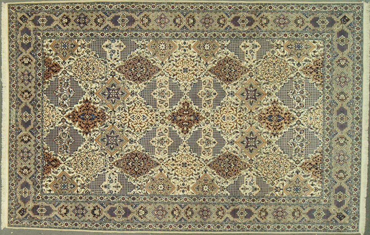 Oriental rug with a central medallion design in muted colors of blue, beige, and brown.