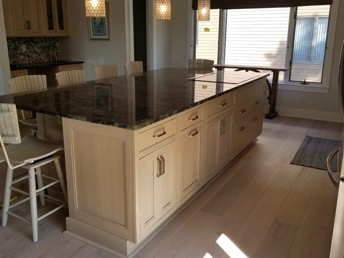 A kitchen with a large island in the middle