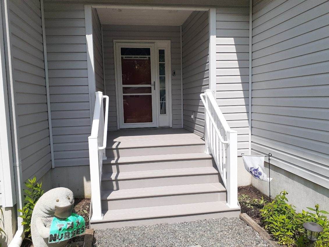 There is a statue of a seal in front of the entrance to the house.