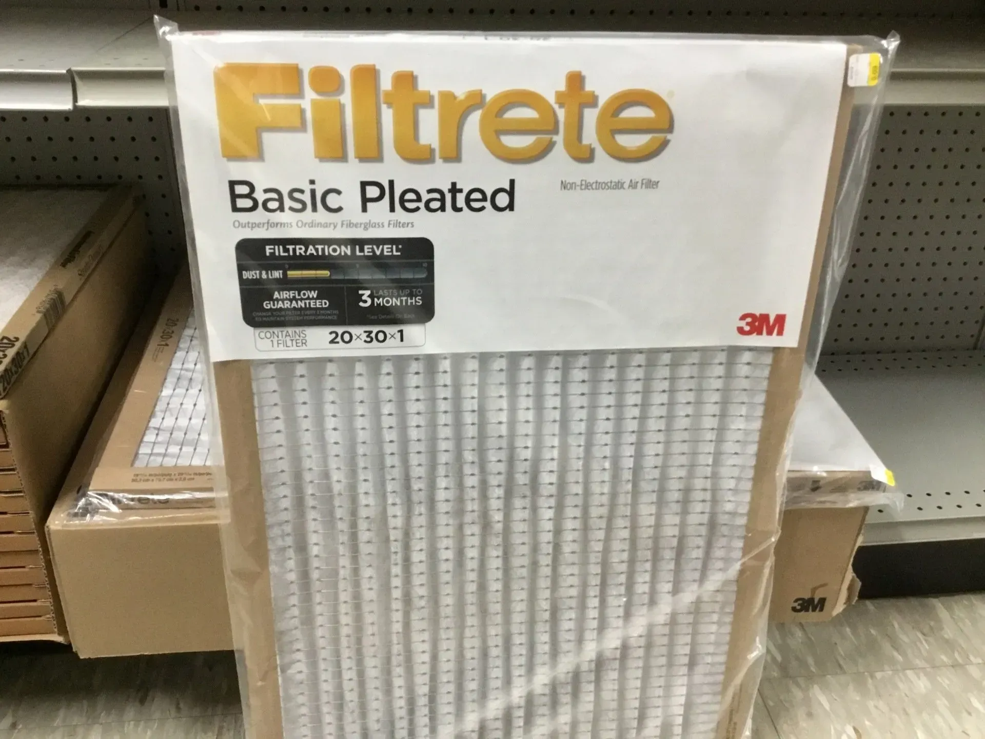 3M Filtrete Basic Pleated air filter in retail packaging on a store shelf