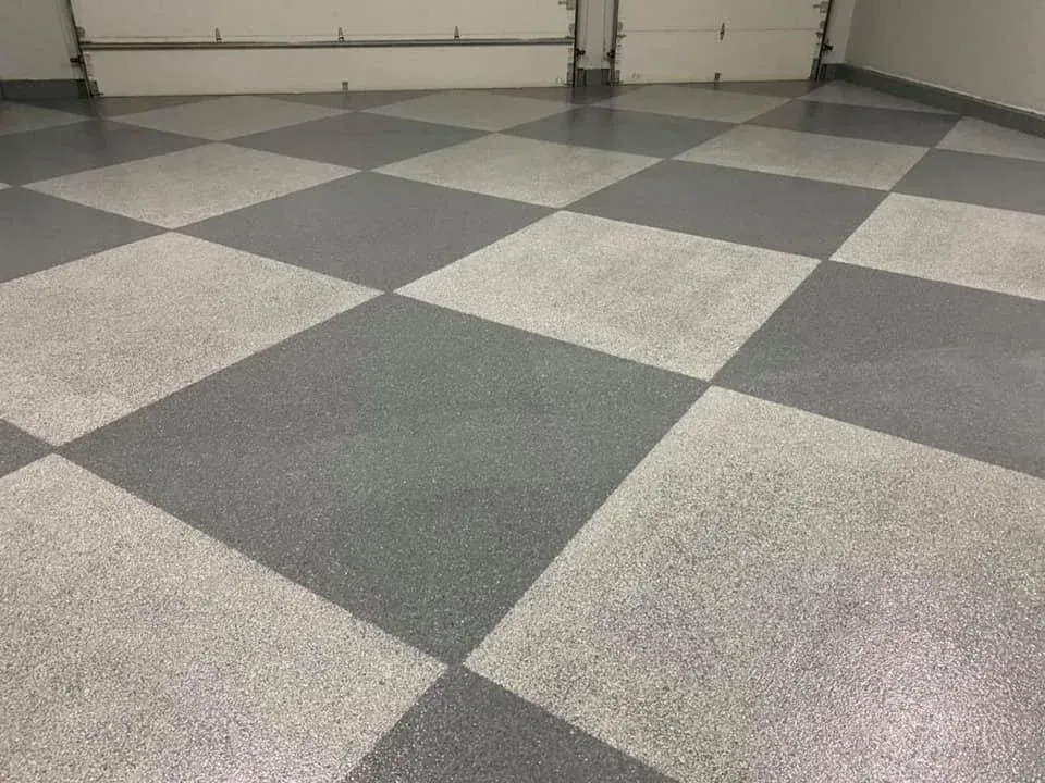 Gray and white checkered garage floor with a glossy finish.