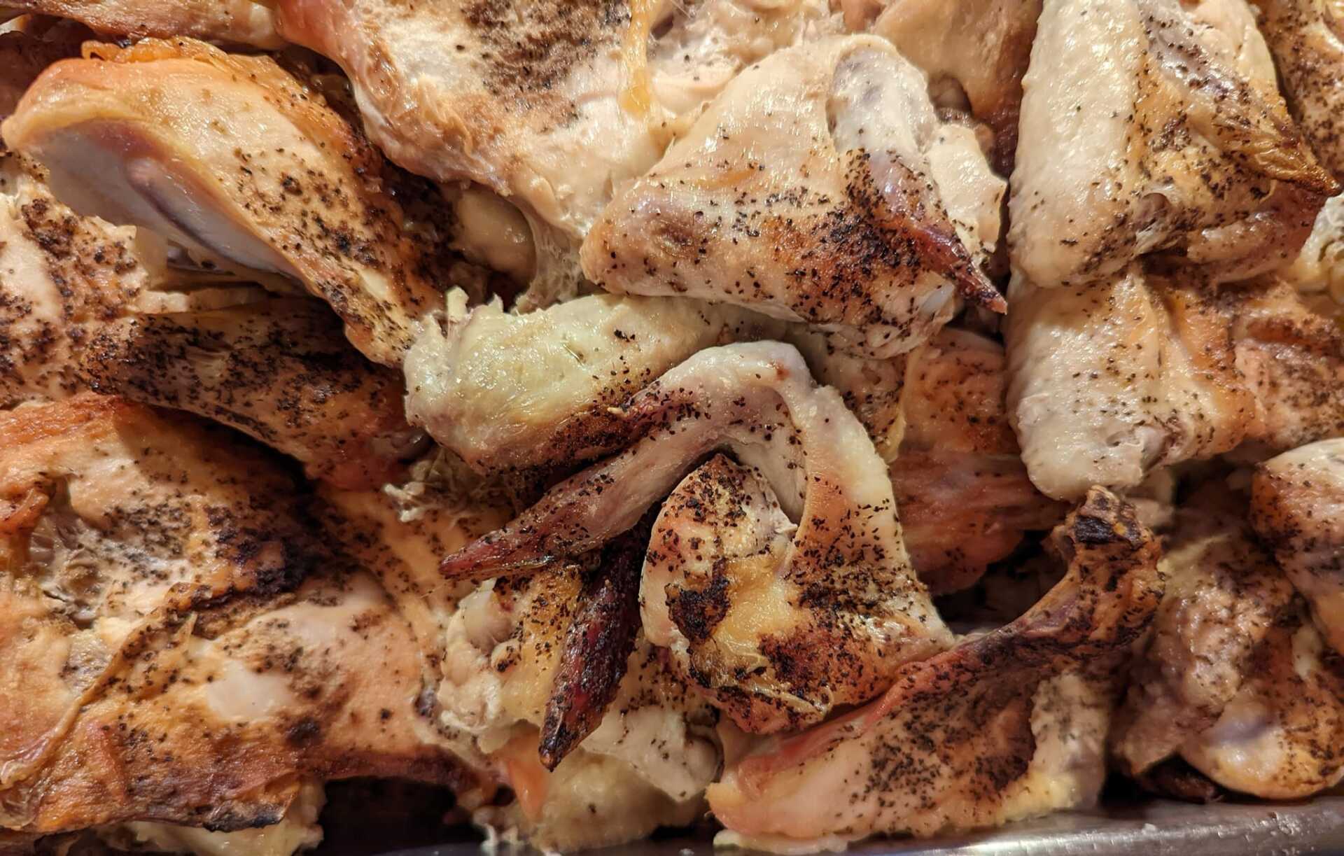 A close up of a pile of chicken on a plate