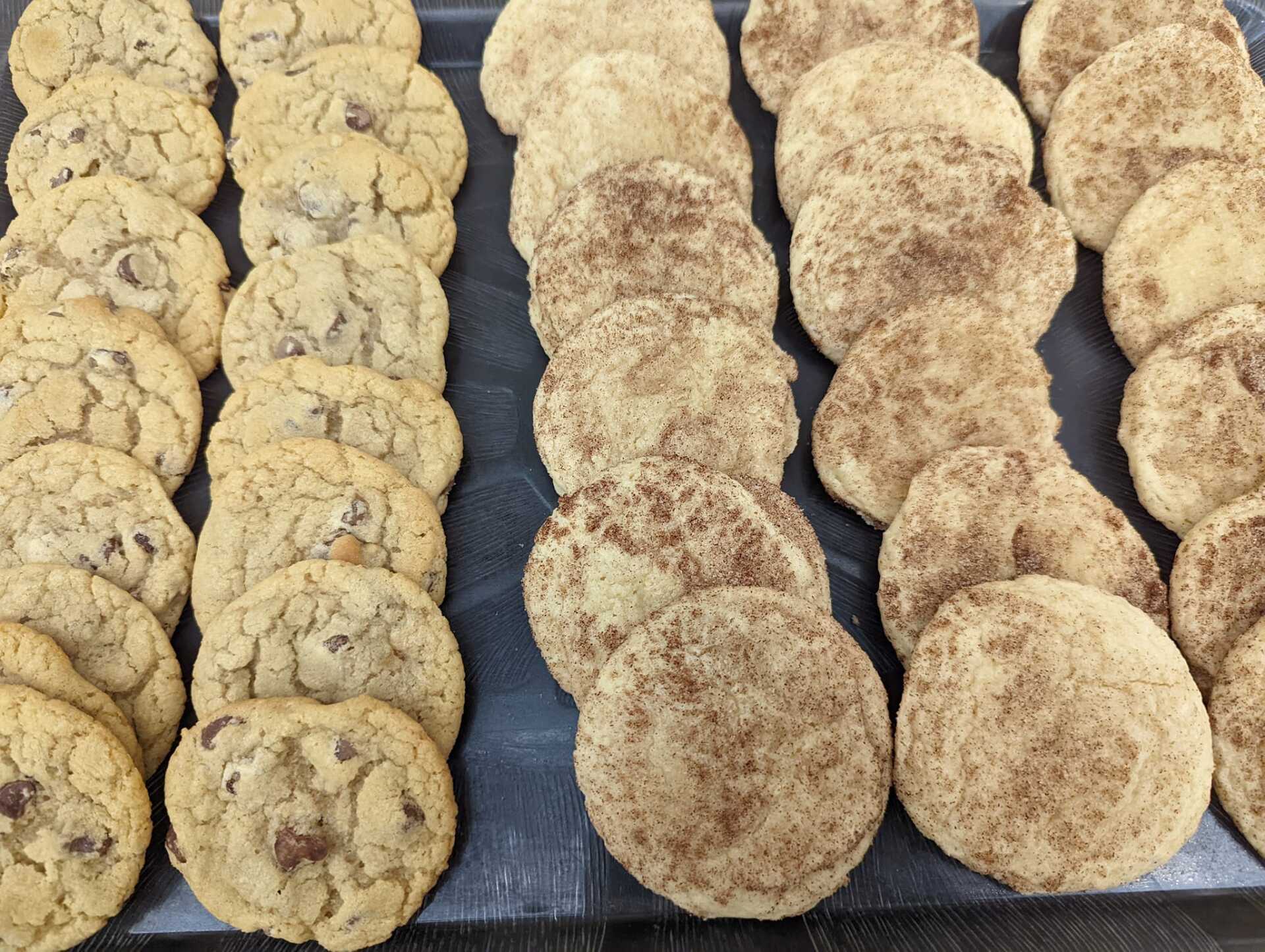 There are many different types of cookies on the tray.