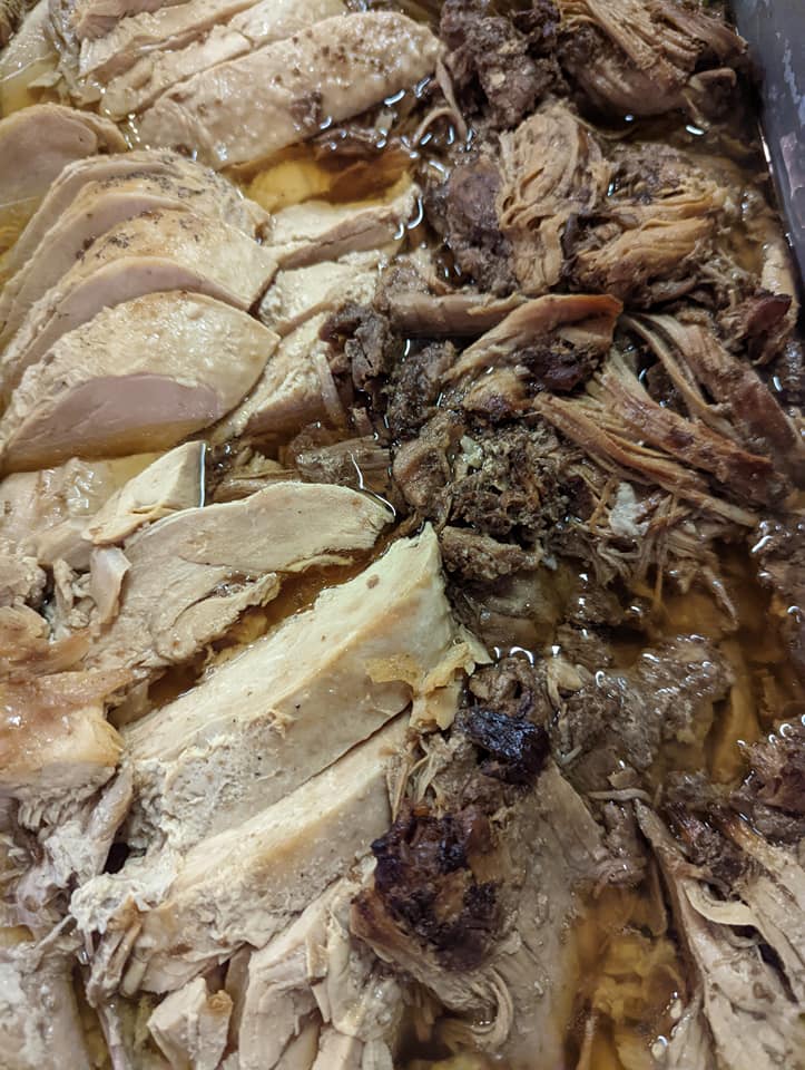 A close up of a pile of meat in a sauce.