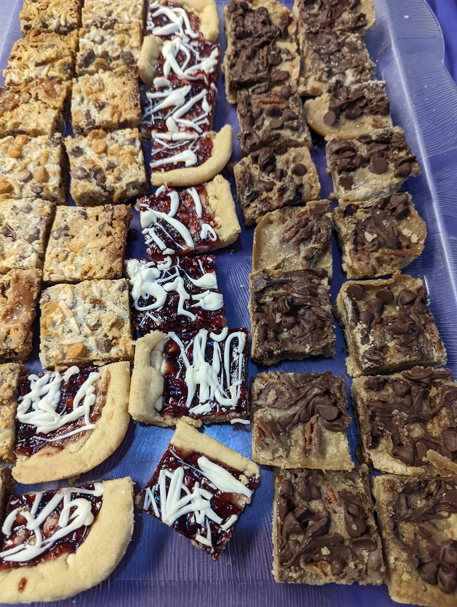 There are many different types of cookies on the tray.