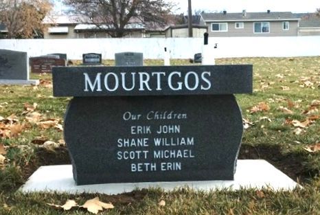 Headstone in a cemetery for the Mourgos family. Includes names of their children, Erik, Shane, Scott, and Beth.