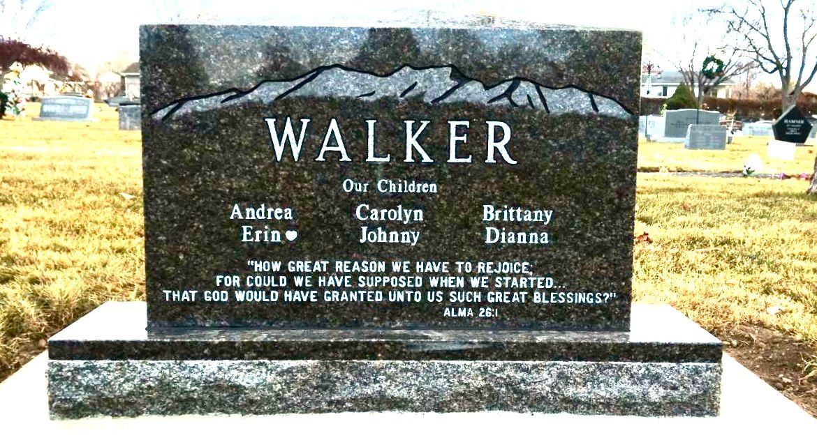 Tombstone in a cemetery, engraved WALKER with names: Andrea, Eric, Carolyn, Johnny, Brittany, Diane. Quote below.