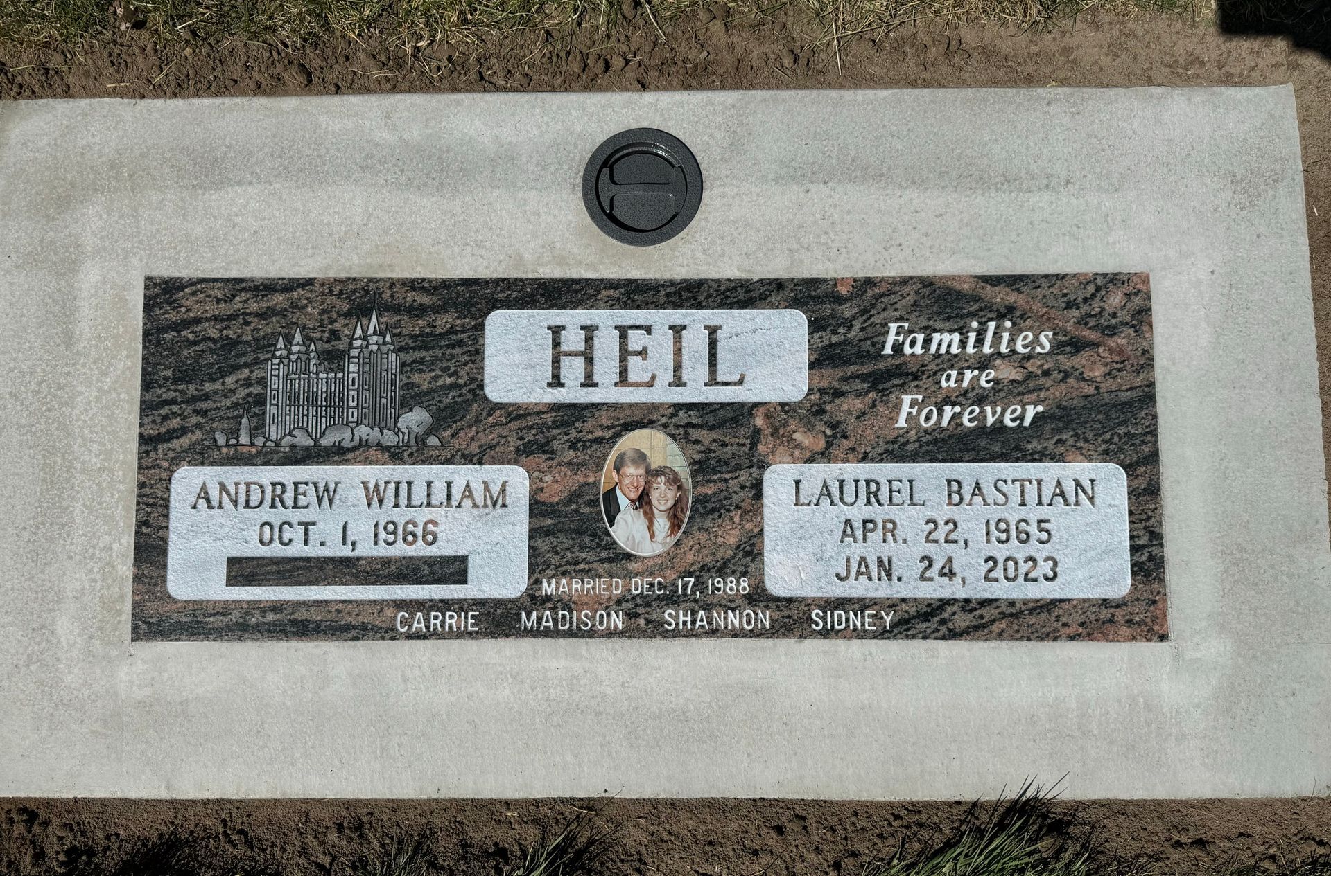 Headstone of a family. Names are Heil, Andrew William, and Laurel Basilan. 