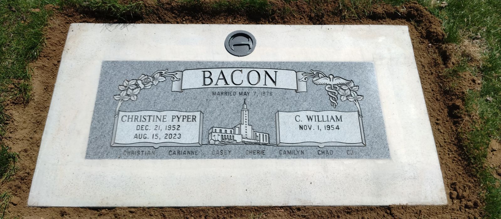 Grave marker for the Bacon family with the names of Christine Yates and C. William Bacon.