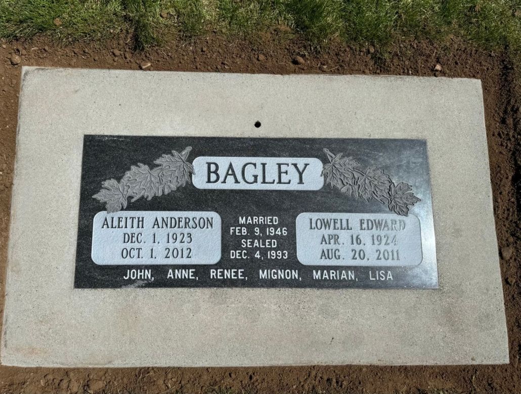Headstone for the Bagley family: names, dates of birth and death, in a grave setting.