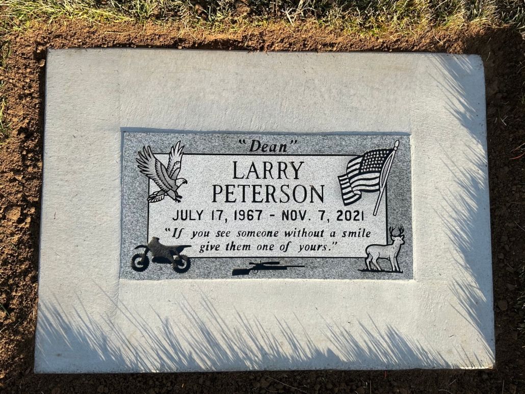 Headstone of Larry Peterson, July 17, 1967 - Nov. 7, 2021, with etched motorcycle, eagle, flag, and quote.
