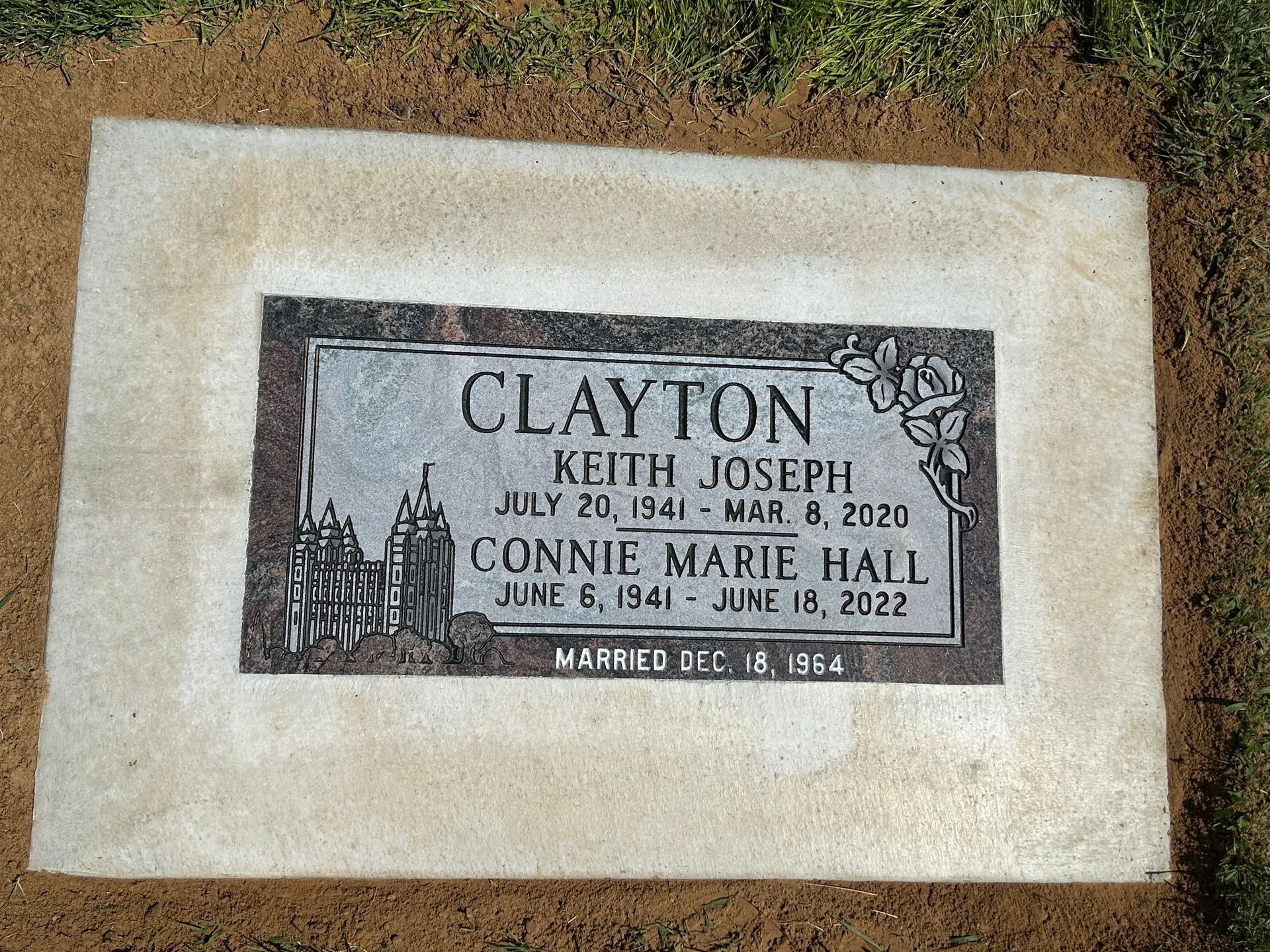 Gravestone for Keith Joseph Clayton (1941-2020) and Connie Marie Hail (1941-2022) with a rose.