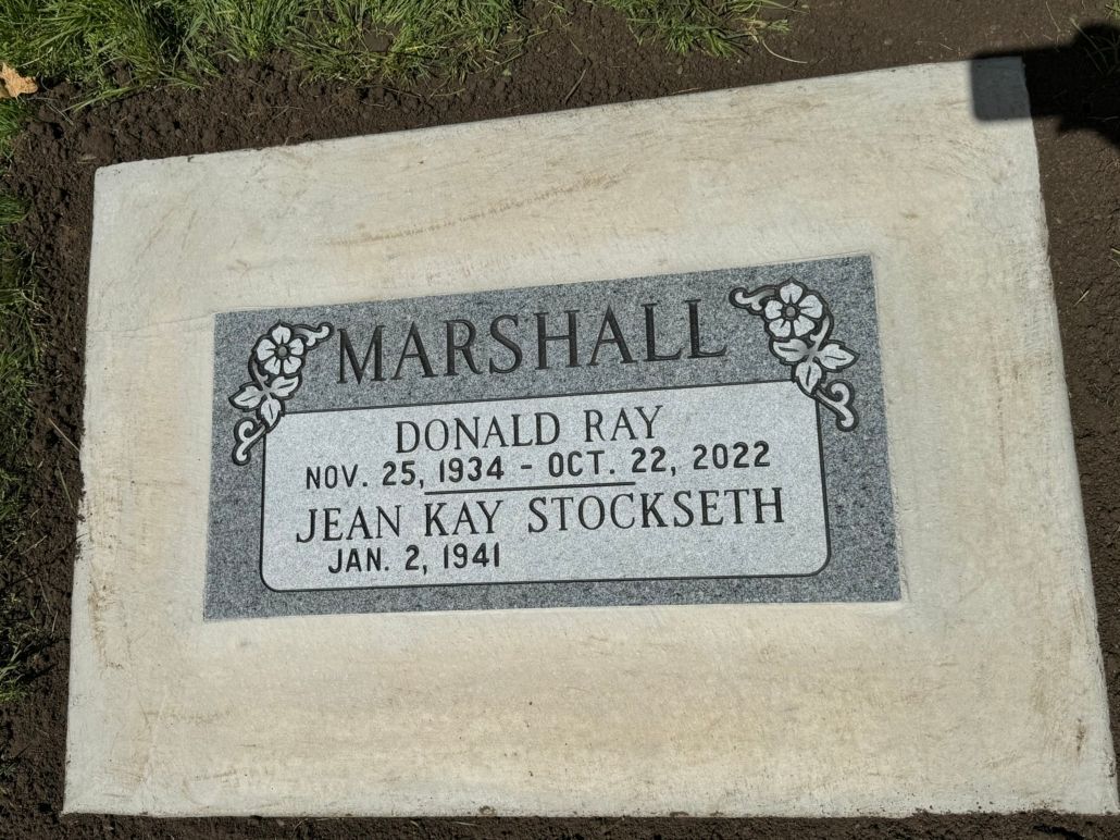 Grave marker for Donald Ray Marshall (1934-2022) and Jean Kay Stockseth (1941) in a grassy setting.