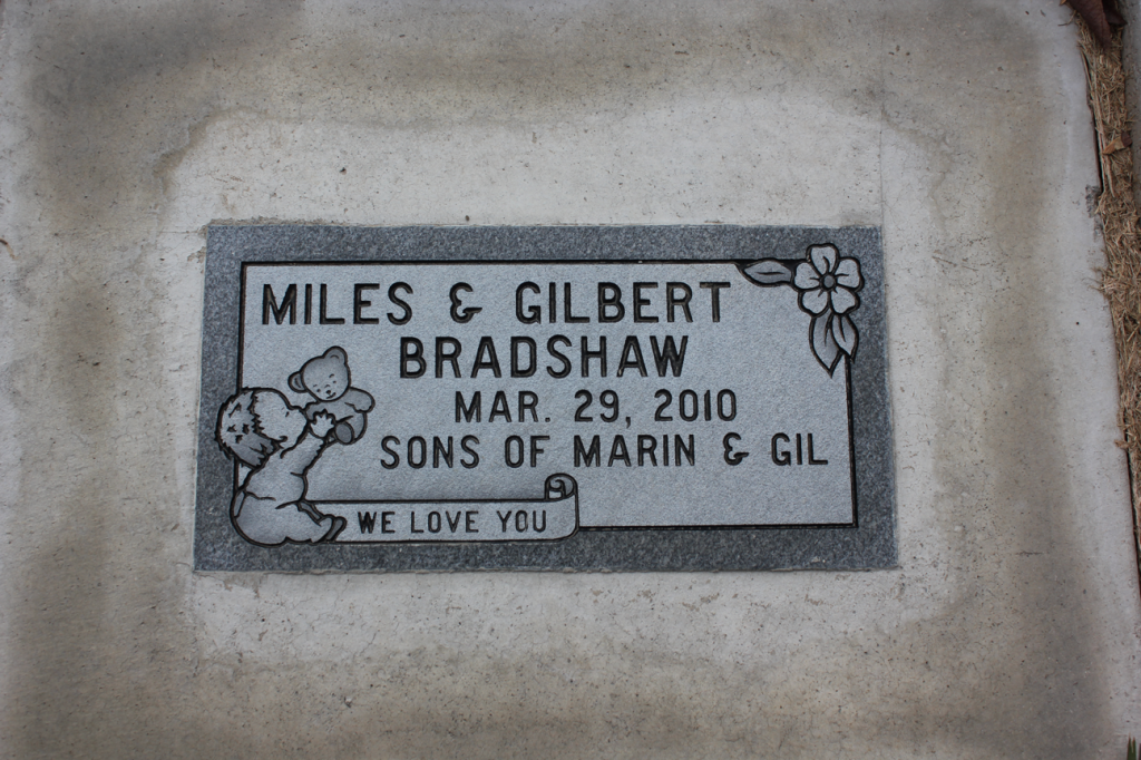Gravestone for Miles & Gilbert Bradshaw, who died March 29, 2010.