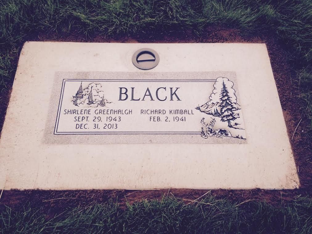 Grave marker of the Black family. Names and dates are inscribed on the stone.