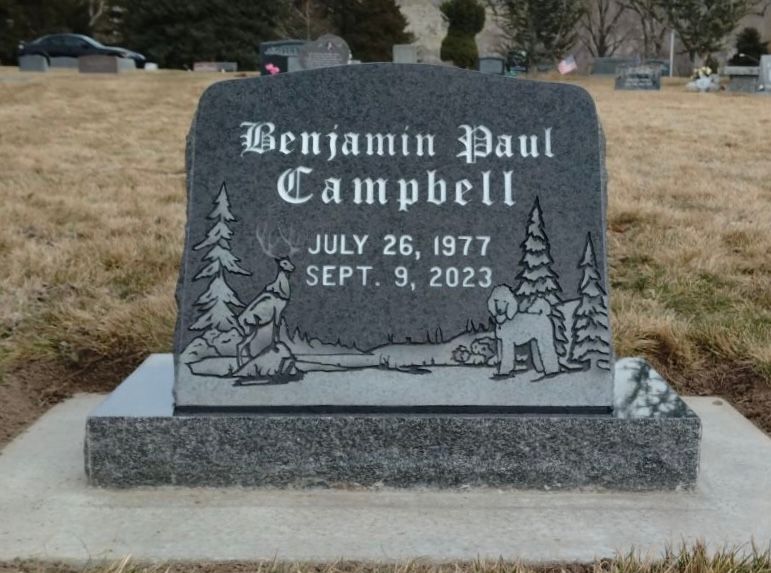 Gray tombstone engraved with 