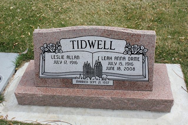 Pink granite tombstone with 