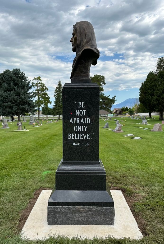 Bust on headstone in cemetery