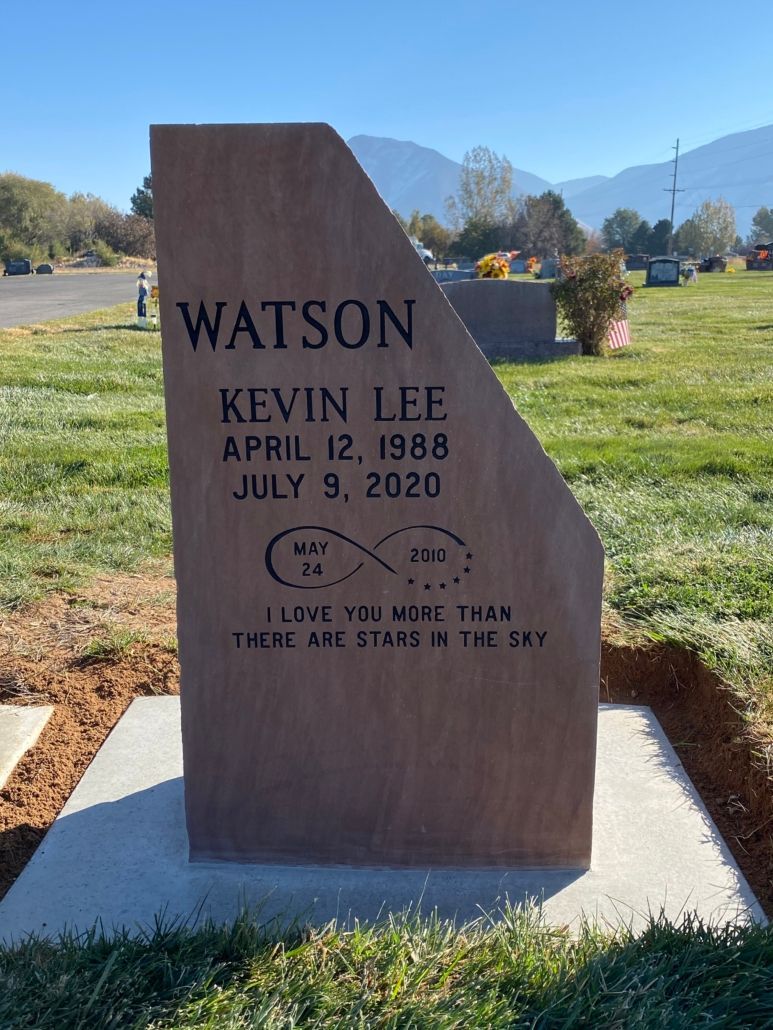 Headstone of Kevin L.E. Watson, born 1988, died 2020, with an infinity symbol