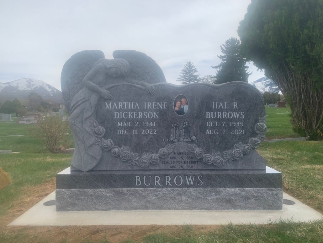 Gray headstone with angel carving; Burrows on base; names and dates engraved.