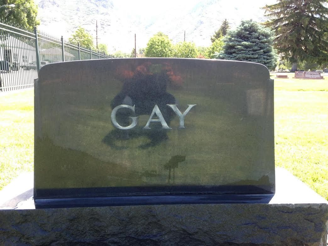Black headstone with the last name GAY - after