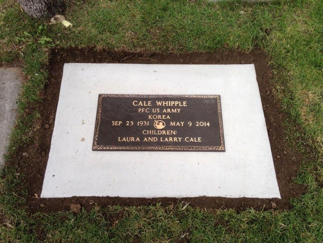 Grave marker for Gale Whipple, a U.S. Army veteran, with a bronze plaque on a concrete slab.