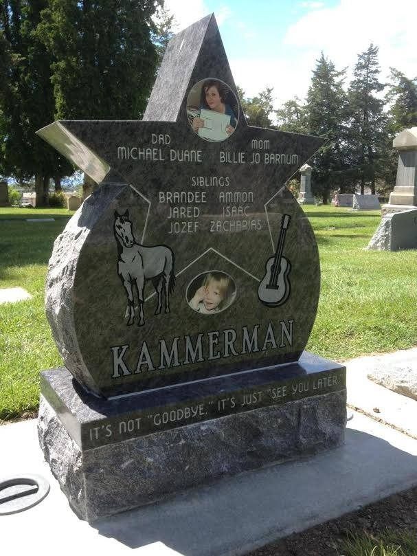 Dark granite tombstone with star design, family names, photos, and symbols: horse and guitar.