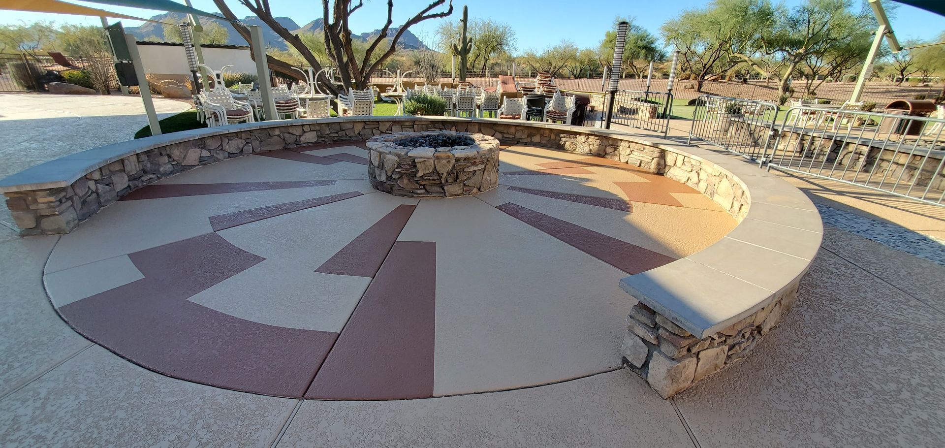 A circular area with a fire pit in the middle of it