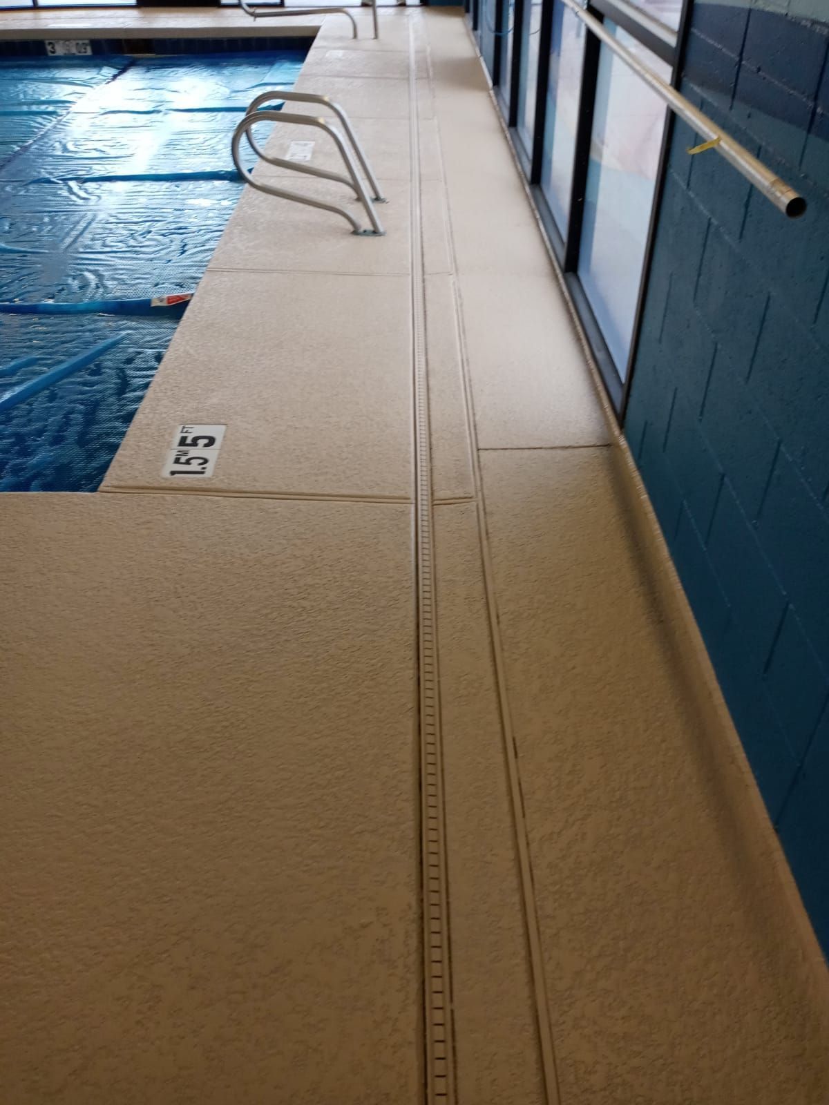 A swimming pool with the number 55 on the side