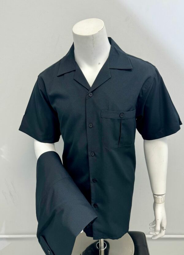 A mannequin is wearing a black shirt and pants