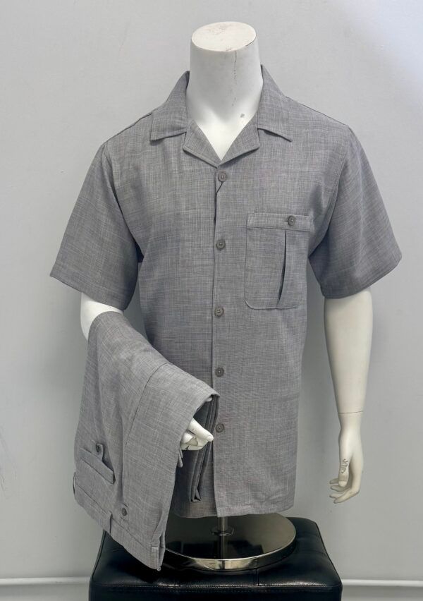 A mannequin is wearing a grey shirt and pants.