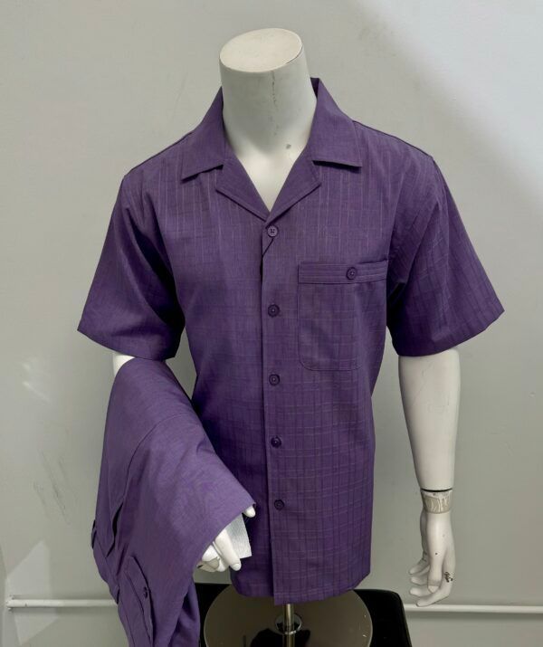 A mannequin is wearing a purple shirt and pants