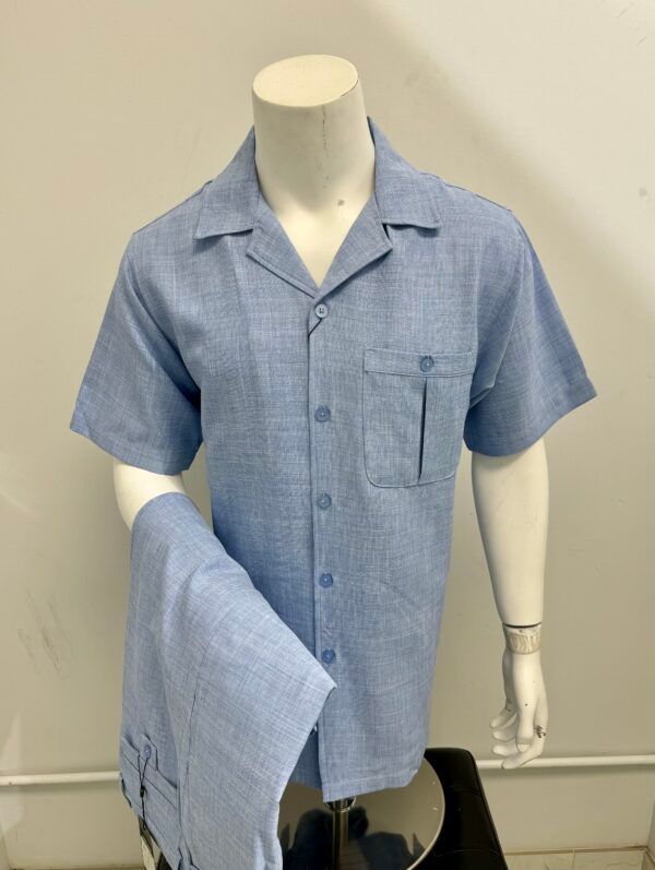 A mannequin is wearing a light blue shirt and pants