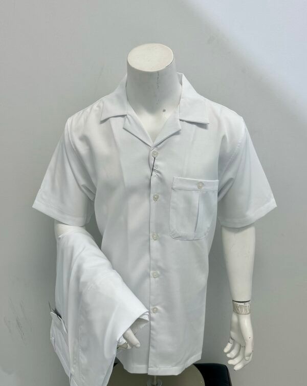 A mannequin is wearing a white shirt and pants