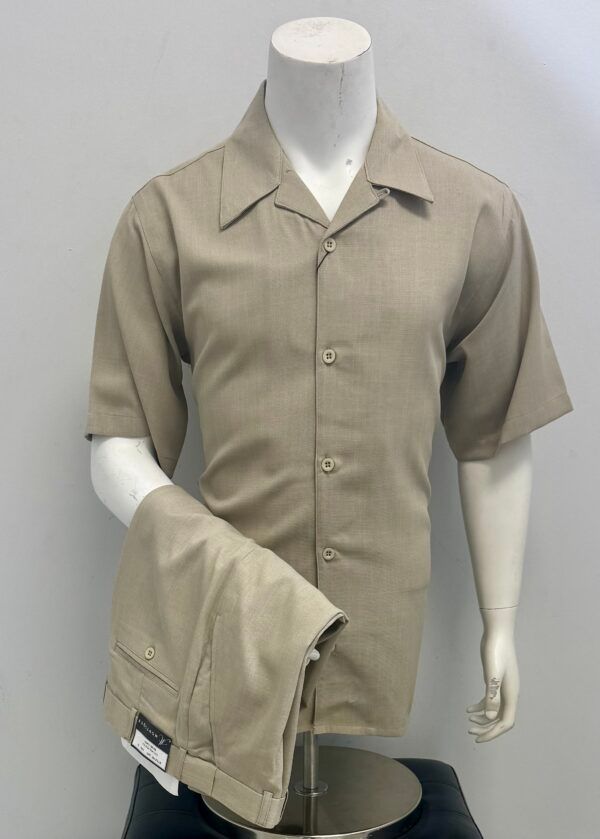 A mannequin is wearing a tan shirt and khaki pants.