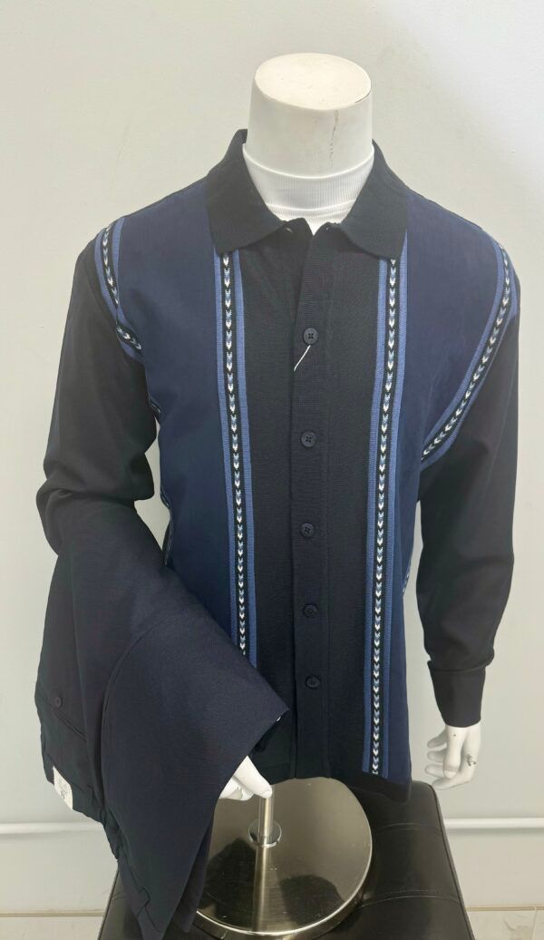 A mannequin is wearing a blue shirt and black jacket.