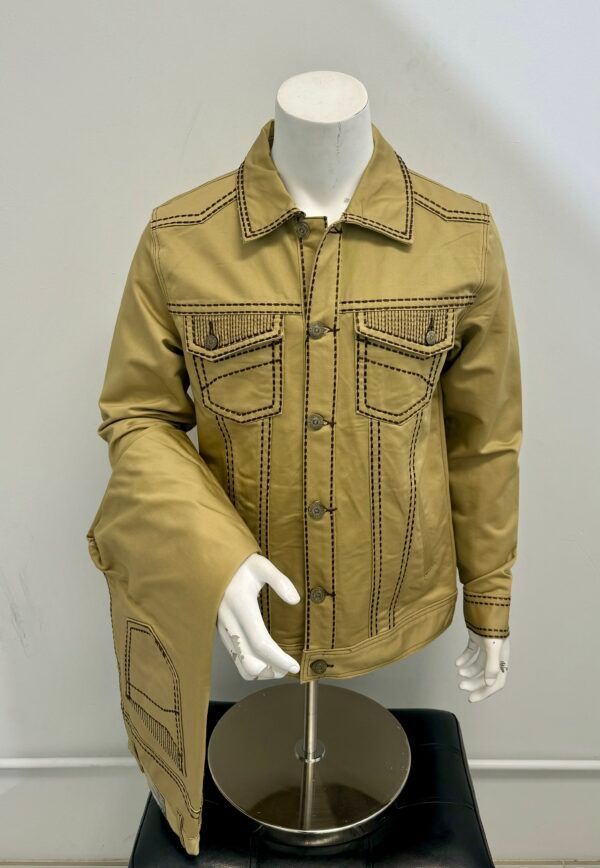 A mannequin is wearing a tan jacket and pants.