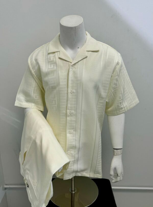 A mannequin is wearing a white shirt and pants.