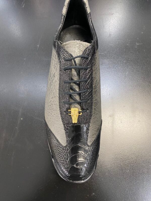 A close up of a pair of shoes on a table.