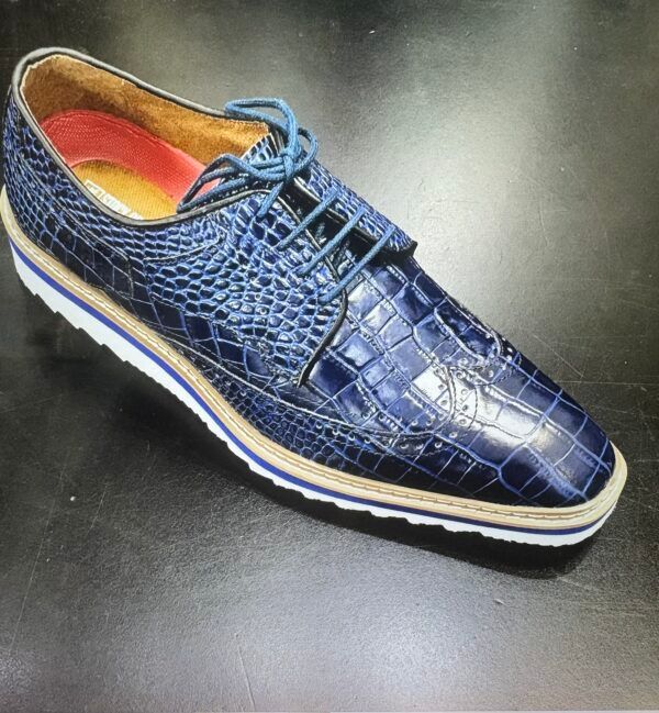 A pair of blue shoes on a black surface