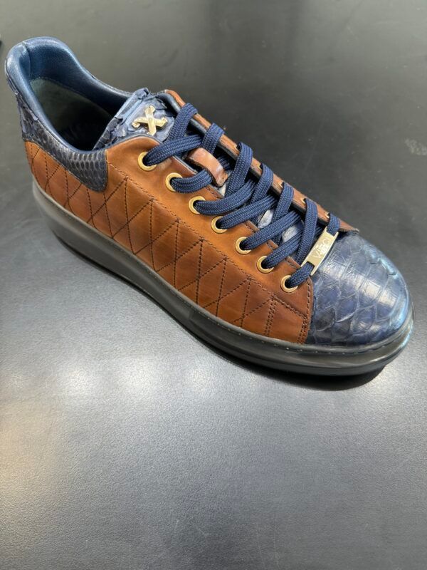 A pair of brown and blue sneakers on a table