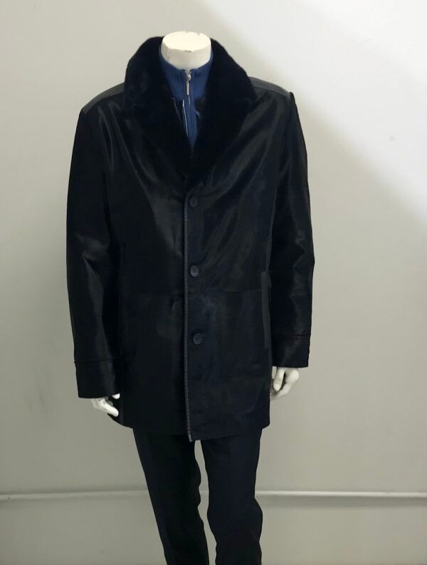 A mannequin wearing a black leather jacket with a fur collar