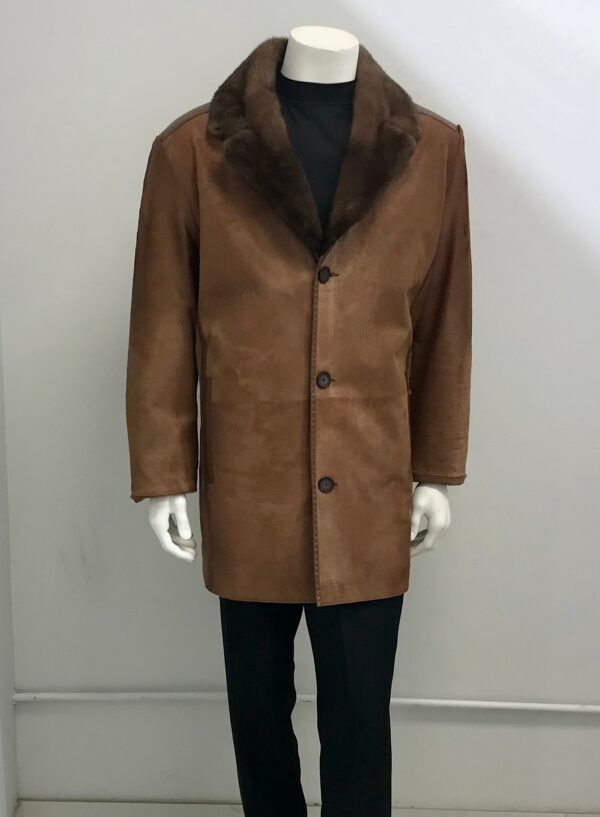 A mannequin wearing a brown coat with a fur collar