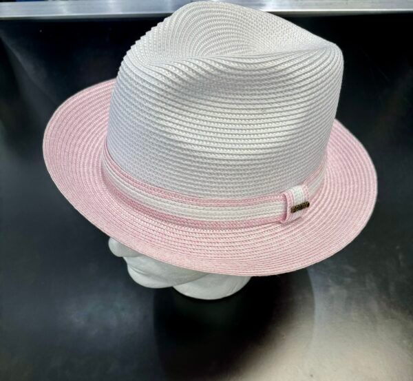 A white and pink hat is on a mannequin head